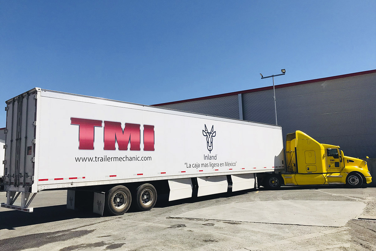 TMI Inland Big White and Yellow Truck